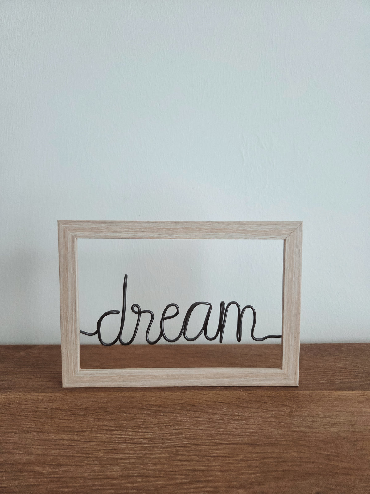 Kader met draadwoord "dream"